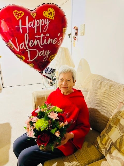 Dora Ballen with a Happy Valentine's Day balloon