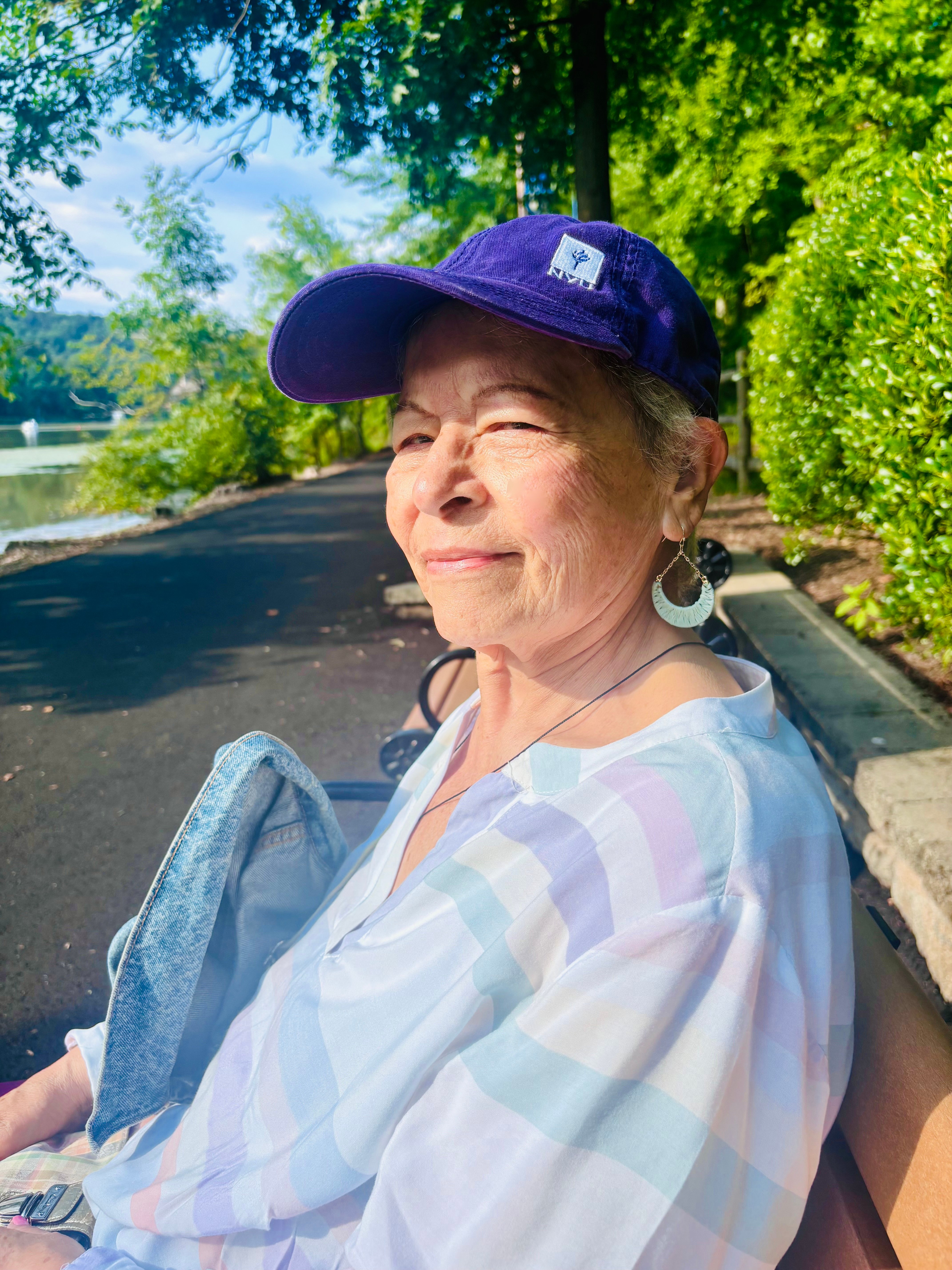 Dora Ballen sitting on a bench outside